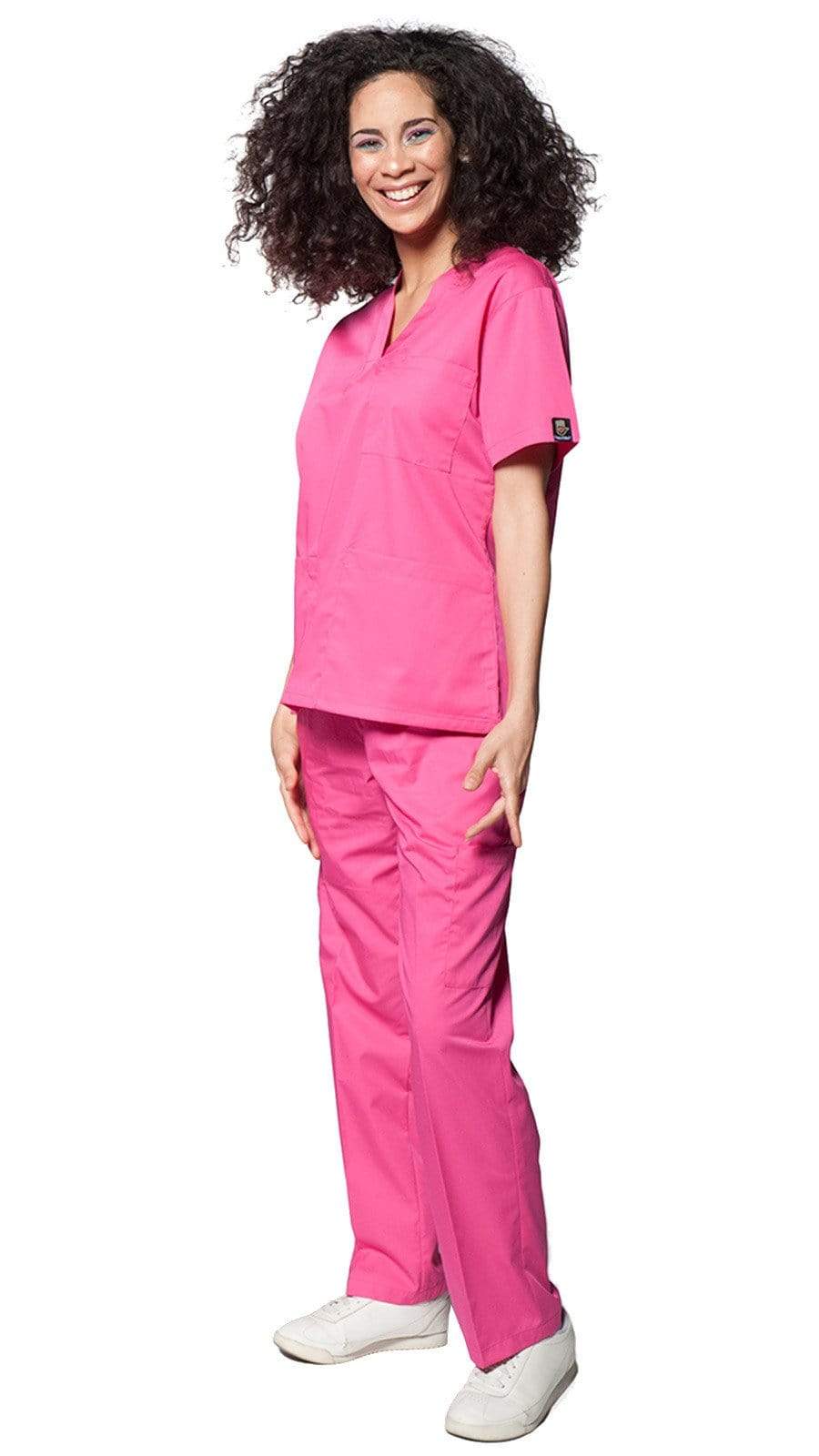 Woman wearing a pink Riri Fit scrub top